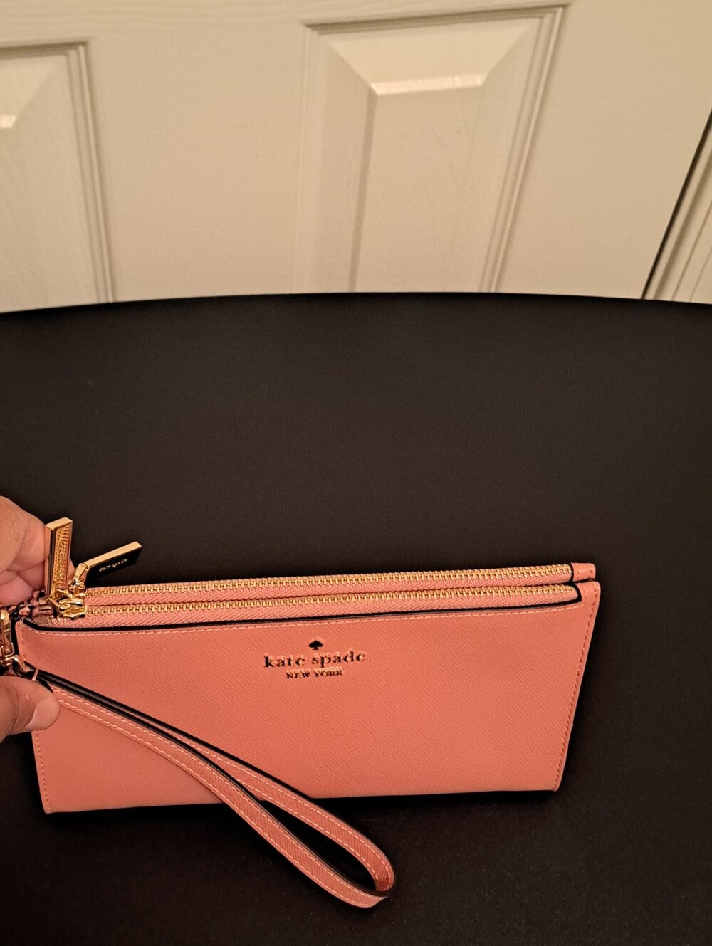 kate spade Coral Pink Double-Zip Wristlet with Gold Hardware like new condition.